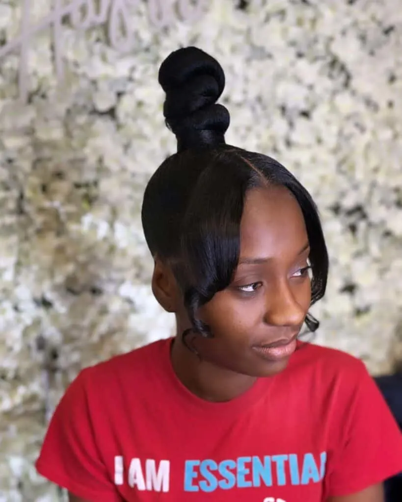 top knot barbie ponytail with curled bangs