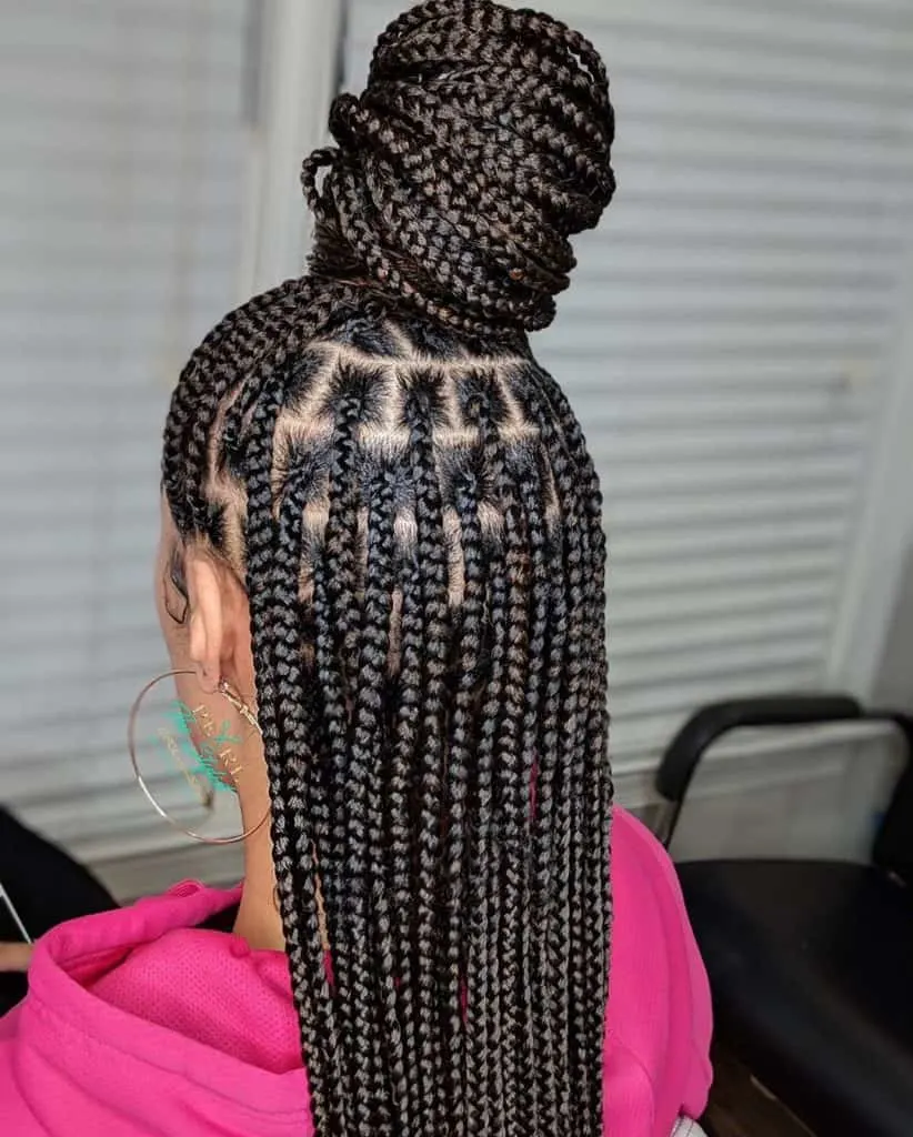 Medium knotless braids half up half down hairstyle