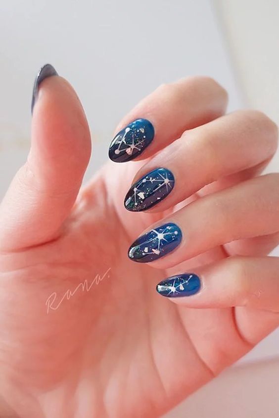 Galaxy nails, galaxy nail designs, and galaxy nail art for a gorgeous manicure