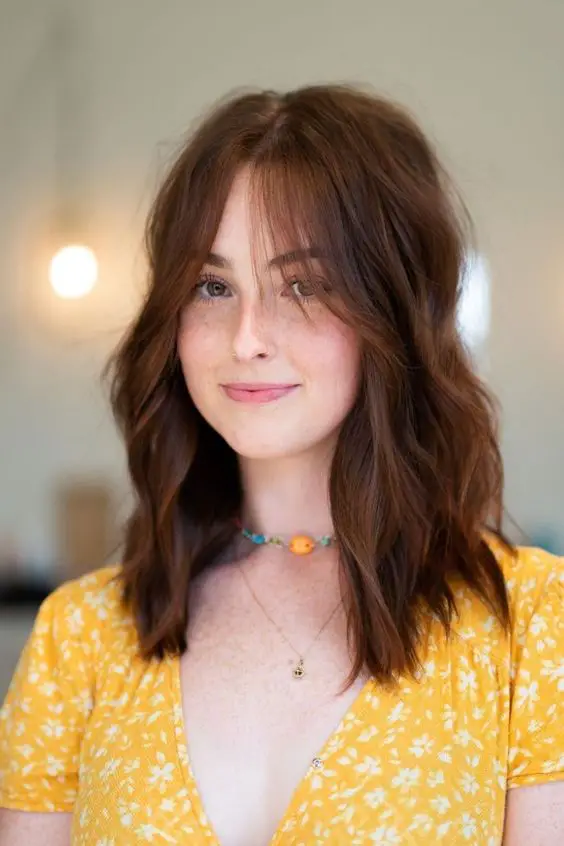 how to style curtain bangs including curtain bangs for long hair, curtain bangs for medium hair, curtain bangs for curly hair, curly bangs for short hair, and more ways to style curtain bangs