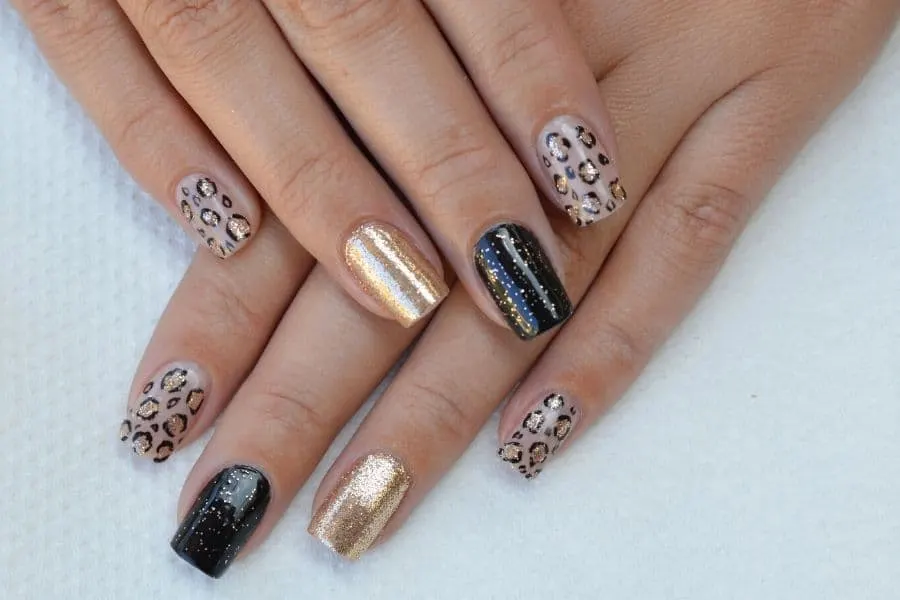 nail designs seen on the catwalk white nails with gold