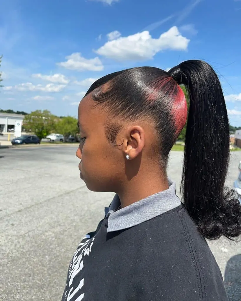 Slicked Barbie Ponytail With Accent Highlights
