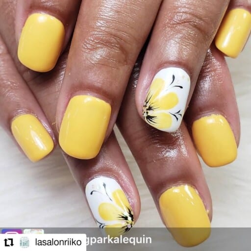 Trendy yellow nail designs for a sunny manicure: Hawaiian Flower Accent