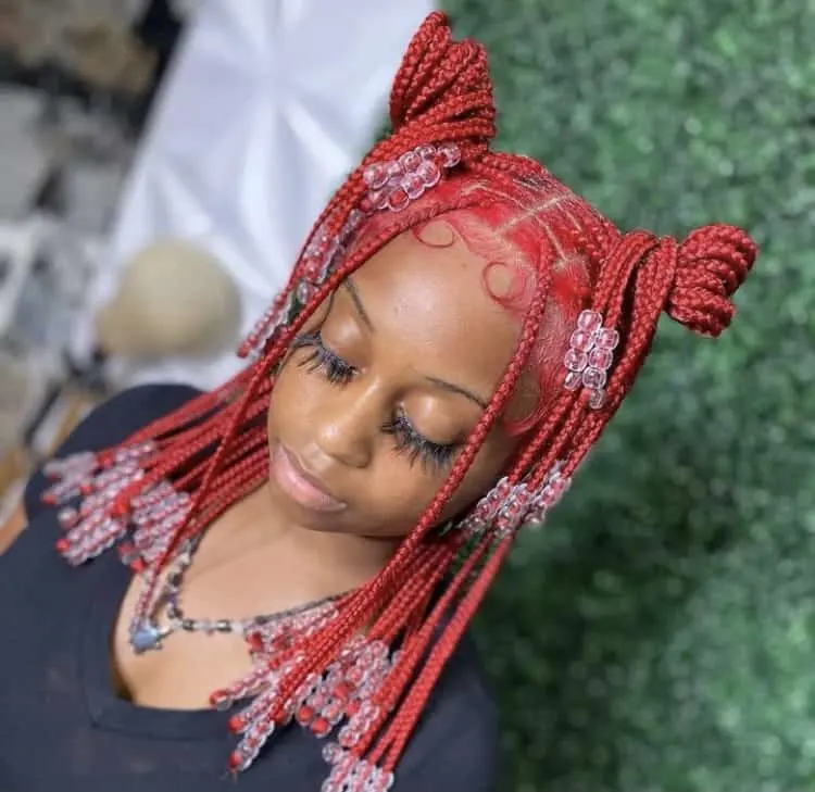 red knotless braids with clear beads