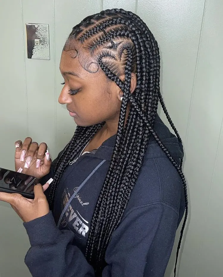 criss cross stitch cornrow braids with a heart shape design