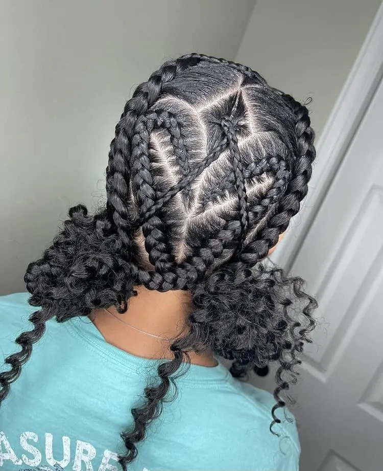 middle part cornrow heart braids with curls