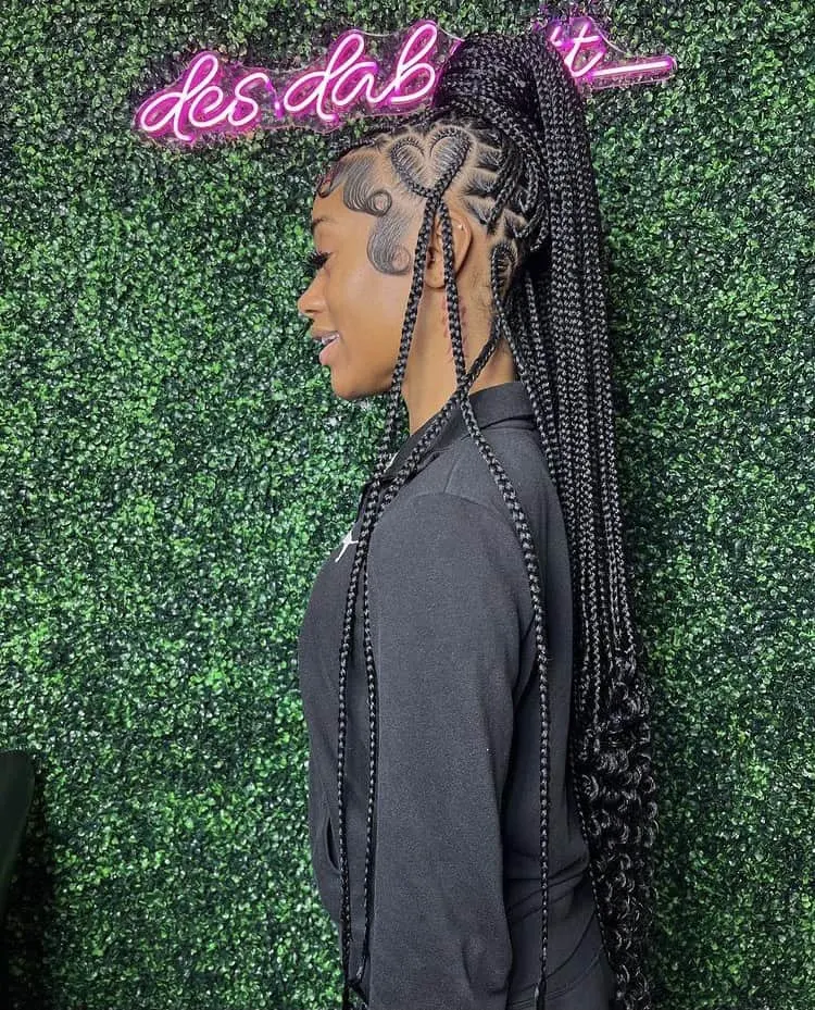 knotless braids with curly ends with a heart