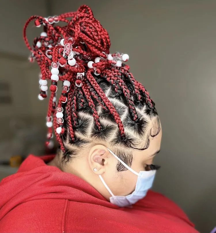 red knotless box braids with beads