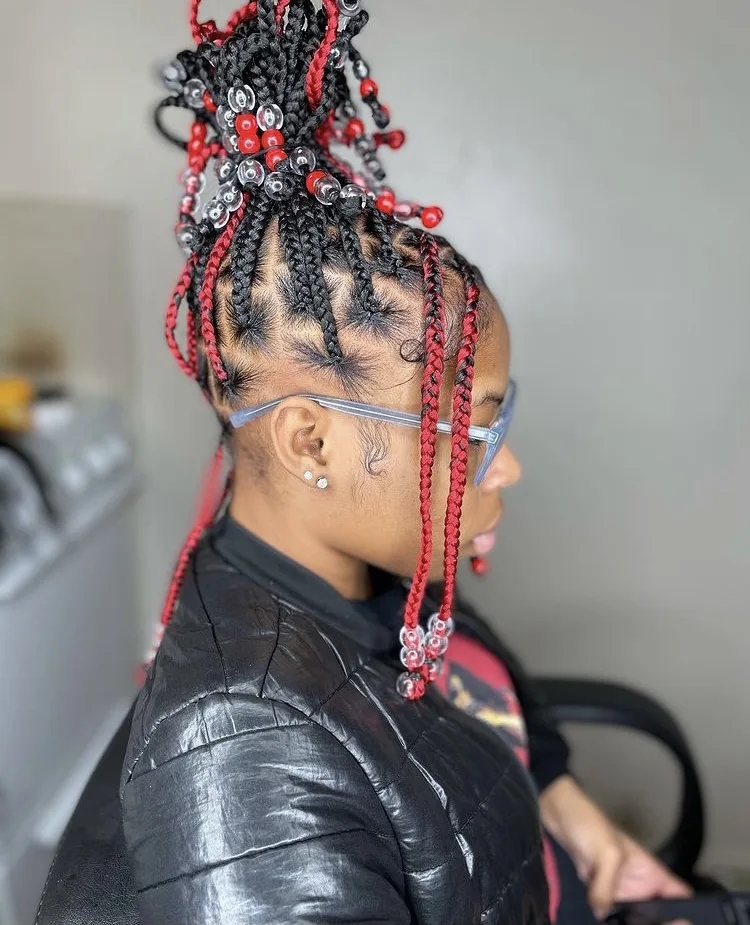 red and black knotless box braids with beads