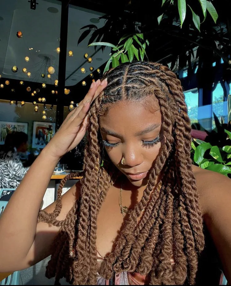 long brown invisible locs with loc knots