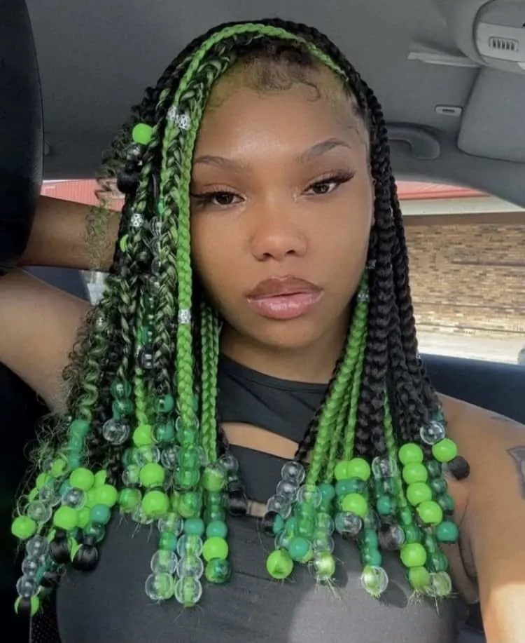 knotless braids with green beads