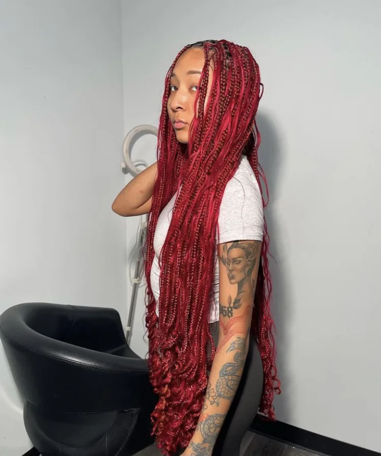 red bohemian knotless braids with human hair curls