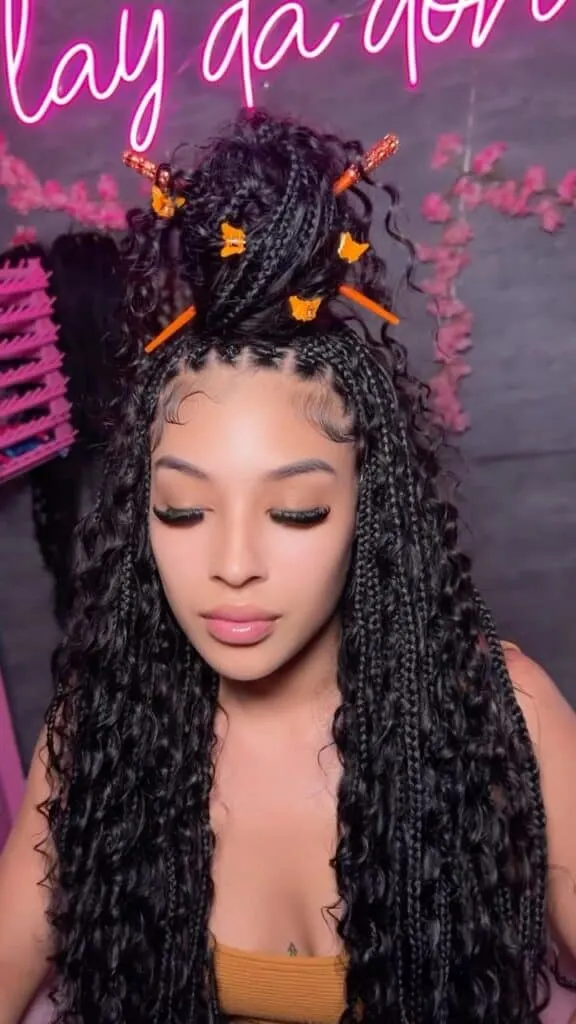 long boho knotless braids with human hair in a top bun