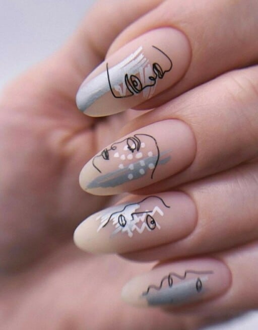 Abstract nail art to inspire your next manicure: Nude With Blue Abstract Faces