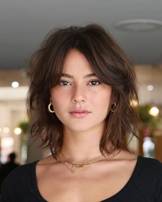 how to style curtain bangs including curtain bangs for long hair, curtain bangs for medium hair, curtain bangs for curly hair, curly bangs for short hair, and more ways to style curtain bangs