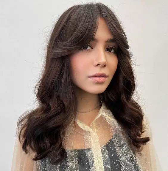 how to style curtain bangs including curtain bangs for long hair, curtain bangs for medium hair, curtain bangs for curly hair, curly bangs for short hair, and more ways to style curtain bangs