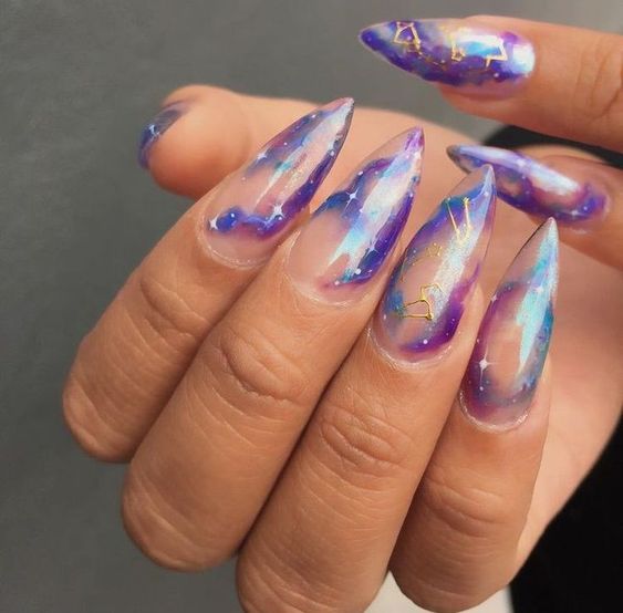 Galaxy nails, galaxy nail designs, and galaxy nail art for a gorgeous manicure