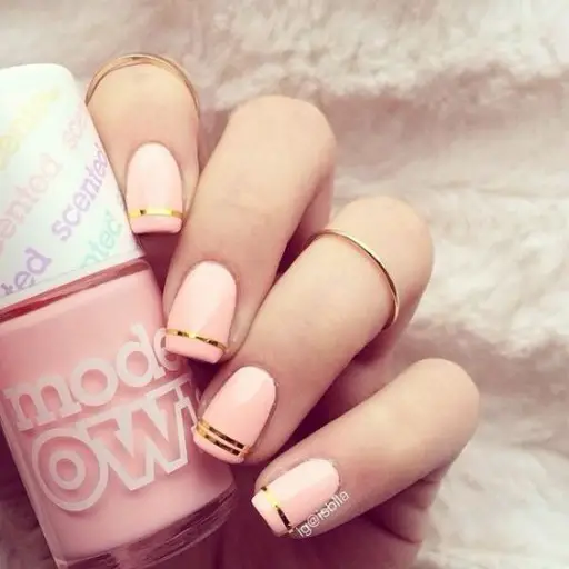 Pink nails examples, the trendiest pink nail colors to use: Gold Stripe Accents