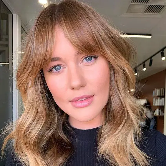 how to style curtain bangs including curtain bangs for long hair, curtain bangs for medium hair, curtain bangs for curly hair, curly bangs for short hair, and more ways to style curtain bangs