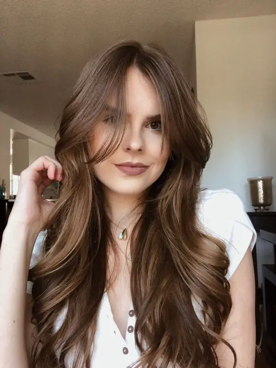 how to style curtain bangs including curtain bangs for long hair, curtain bangs for medium hair, curtain bangs for curly hair, curly bangs for short hair, and more ways to style curtain bangs