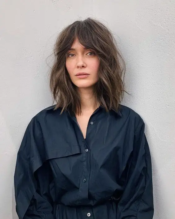 how to style curtain bangs including curtain bangs for long hair, curtain bangs for medium hair, curtain bangs for curly hair, curly bangs for short hair, and more ways to style curtain bangs