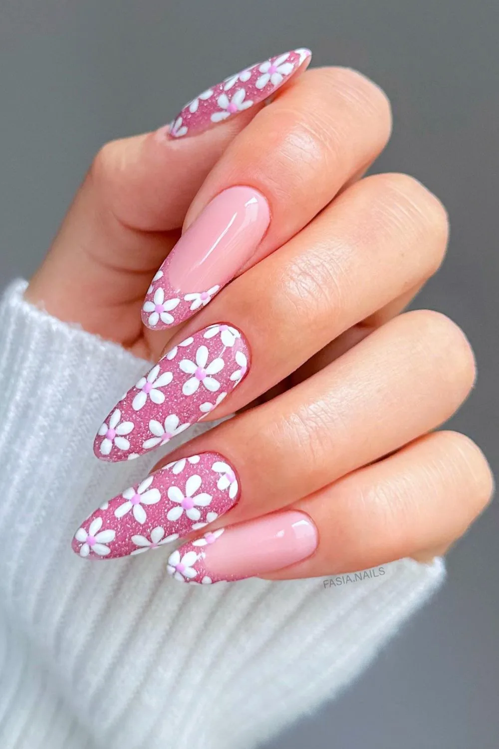 Flower nail designs are trendy, customizable, and easy to create using dotting tools and nail polish.  While traditionally associated with spring, floral nail designs can be embraced year-round by adjusting color palettes to suit the summer, fall or winter.  They work well on natural nails as well as acryllic, gel, or dip nails.  You can also add rhinestones.  Simple, short nails, french tips, almond, blue, pink, green, coffin, white, purple, cute, simple.