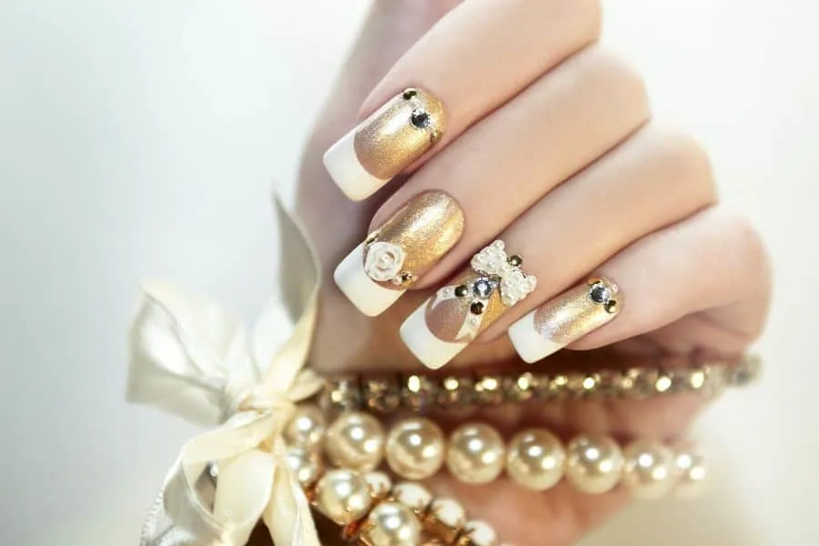 white nails with gold