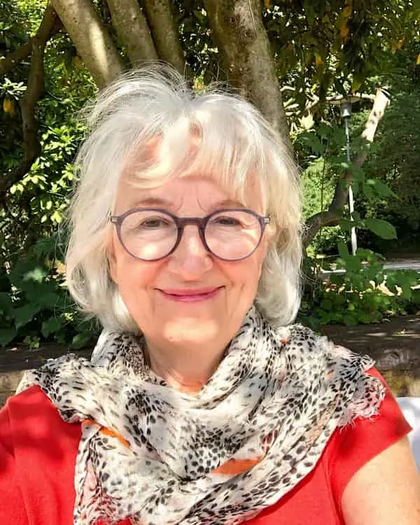 Curly Hair with Bangs for Older Women with Glasses