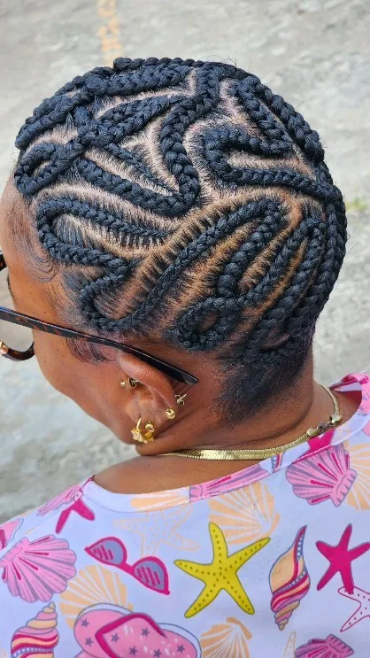 The braided bald head cornrows with a heart design